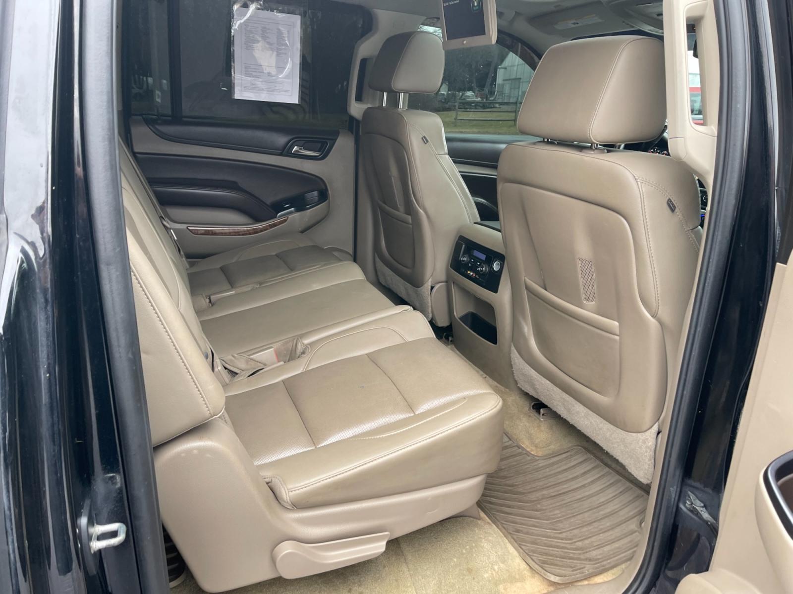 2016 Black /Brown Chevrolet Suburban LTZ 4WD (1GNSKJKC3GR) with an 5.3L V8 OHV 16V engine, 6A transmission, located at 11115 Chardon Rd. , Chardon, OH, 44024, (440) 214-9705, 41.580246, -81.241943 - This 2016 Chevrolet Suburban LTZ 4WD comes equipped with a 5.3 Vortec V8 engine and a 6-speed automatic transmission, offering a robust 8,000-pound towing capacity. It's designed with luxury and convenience in mind, featuring heated and cooled front seats, heated second-row seats, and a range of saf - Photo #53